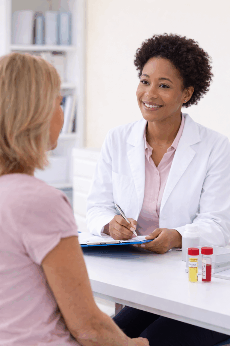 Smiling doctor consulting patient with blood samples